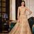 Soft premium net wedding wear semi stitch gown in golden color with embroidery