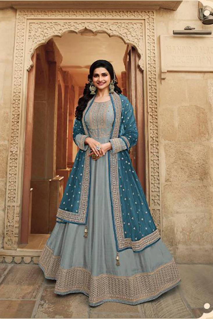 Dola silk party wear semi stitch gown in grey color with embroidery work and stone work