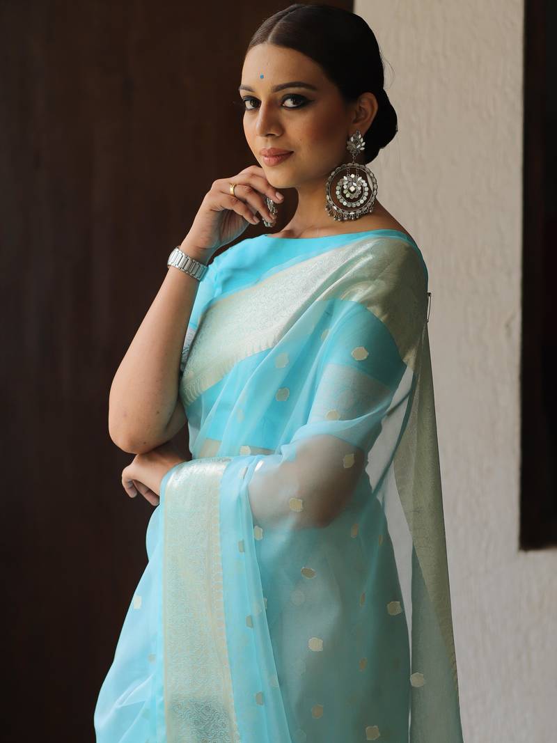 Woven With Tradition And Crafted For Modernity Organza Saree With Zari Butti Work And A Matching Organza Blouse 