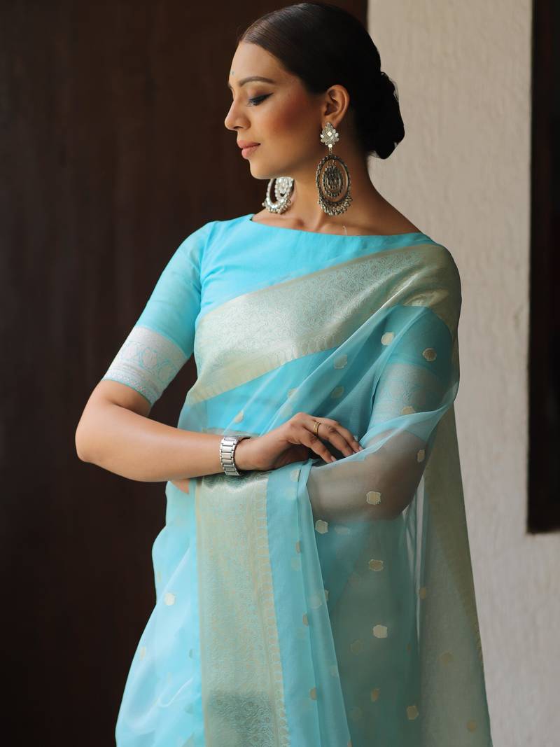 Woven With Tradition And Crafted For Modernity Organza Saree With Zari Butti Work And A Matching Organza Blouse 