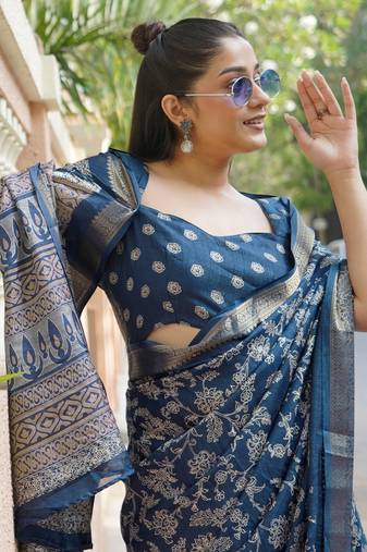Dark rama blue silk blend kalamkari print/floral print golden woven border saree with unstitched blouse piece