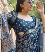 Dark rama blue silk blend kalamkari print/floral print golden woven border saree with unstitched blouse piece