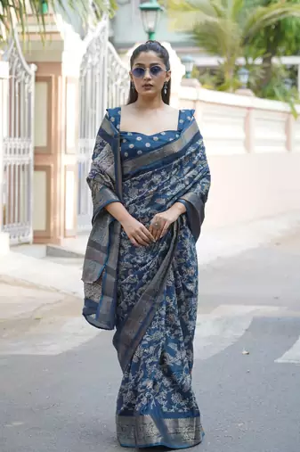 Dark rama blue silk blend kalamkari print/floral print golden woven border saree with unstitched blouse piece