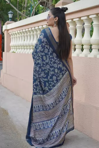 Dark rama blue silk blend kalamkari print/floral print golden woven border saree with unstitched blouse piece