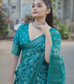 Teal silk blend kalamkari print/floral print golden woven border saree with unstitched blouse piece