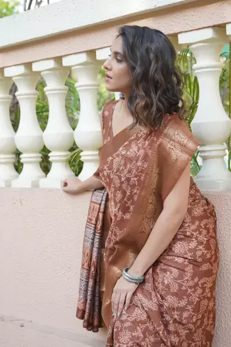 Dusty rust silk blend kalamkari print/floral print golden woven border saree with unstitched blouse piece