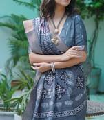 Greyish blue silk blend floral print golden zari border saree with unstitched blouse piece