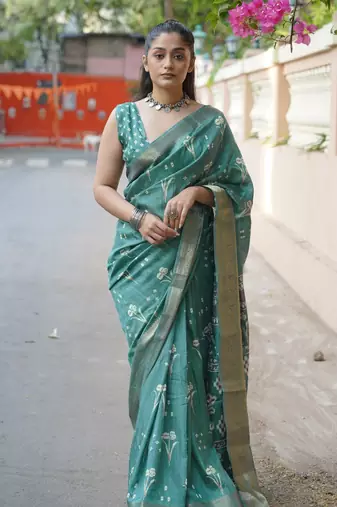 Dusty turquoise silk blend floral print/ikkat print/block print golden woven border saree with unstitched blouse piece