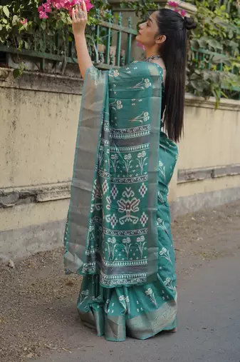 Dusty turquoise silk blend floral print/ikkat print/block print golden woven border saree with unstitched blouse piece