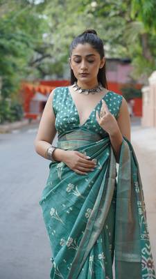 Dusty turquoise silk blend floral print/ikkat print/block print golden woven border saree with unstitched blouse piece 5