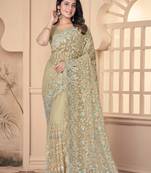 Beige heavy resham stone embroidery work net saree