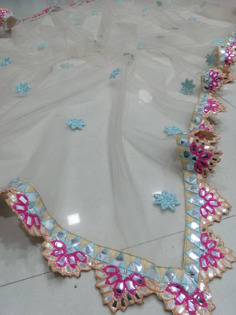 Attractive Multicolored Cotton Thread Embroidered with paper mirror work net fabric Designer Lehenga choli designs