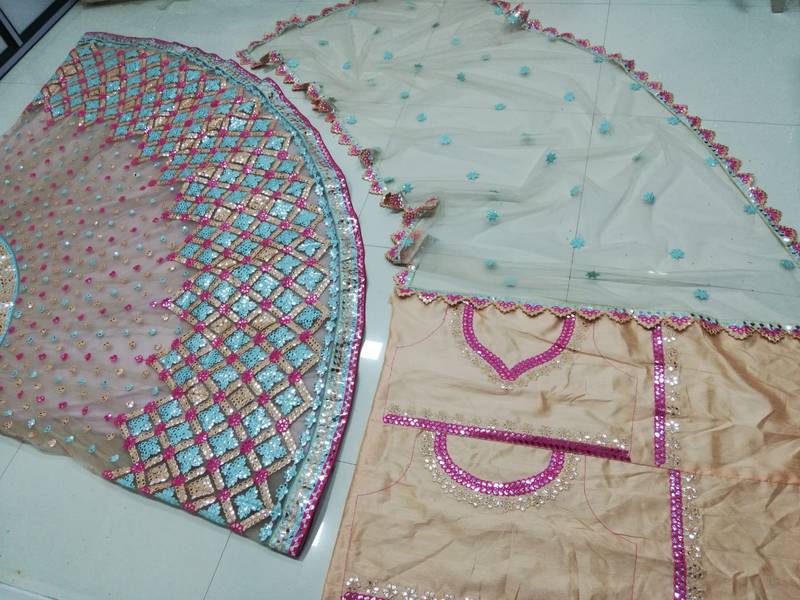 Attractive Multicolored Cotton Thread Embroidered with paper mirror work net fabric Designer Lehenga choli designs