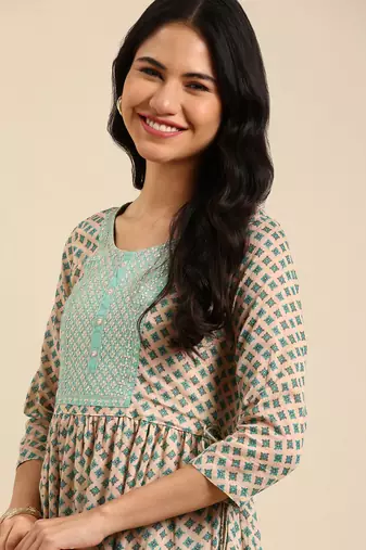 women's knee length round neck beige floral straight kurta