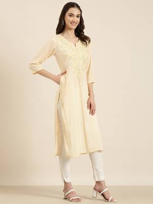 women's calf length round neck peach solid straight kurta 4