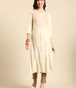 women's calf length round neck cream embellished straight kurta