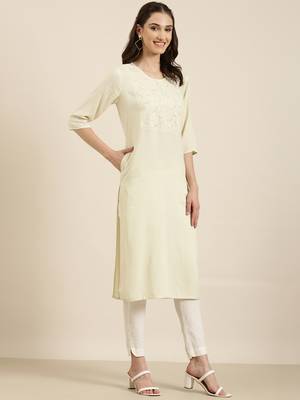 women's calf length round neck cream solid straight kurta 4