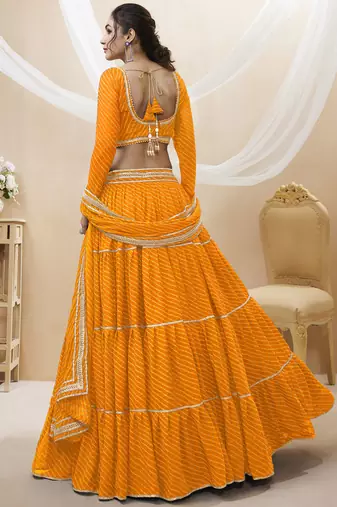 Enchanting Yellow Laheriya Print Georgette Designer Lehenga Choli