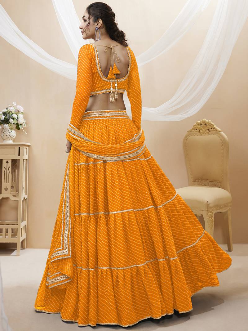 Enchanting Yellow Laheriya Print Georgette Designer Lehenga Choli