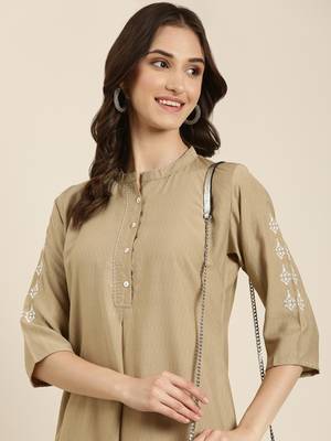 women's calf length round neck beige woven design straight kurta 1