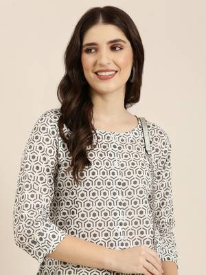 women's calf length round neck cream geometric a-line kurta 1