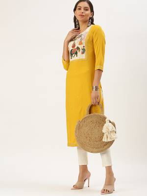 Showoff women's calf length round neck yellow embellished straight kurta 1