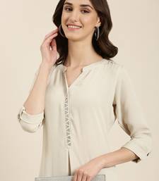 Showoff women's calf length mandarin collar beige solid straight kurta