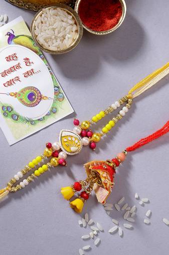  unisex set of 2 yellow peacock design bhaiya bhabhi rakhi with roli chawal
