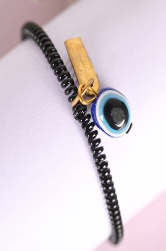  unisex black evil eye spring ring rakhi with roli chawal