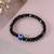 Nvr unisex black evil eye elasticated rakhi with roli chawal