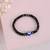 Nvr unisex black evil eye elasticated rakhi with roli chawal