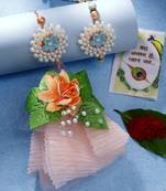  unisex set of 2 peach floral design pearl beaded bhaiya bhabi rakhi with roli chawal & chocolate