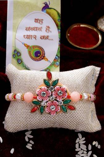  men pink floral shape stone-studdded & beaded rakhi with roli chawal & chocolate
