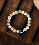 Nvr unisex cream-colored evil eye elasticated rakhi with roli chawal