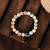 Nvr unisex cream-colored evil eye elasticated rakhi with roli chawal