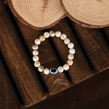 Nvr unisex cream-colored evil eye elasticated rakhi with roli chawal 5