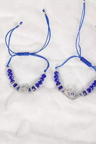  unisex set of 2 blue evil eye rakhi with roli chawal