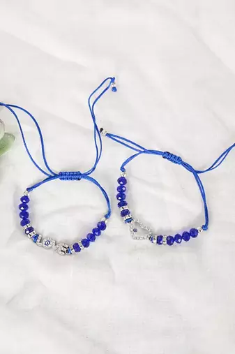  unisex set of 2 blue evil eye rakhi with roli chawal