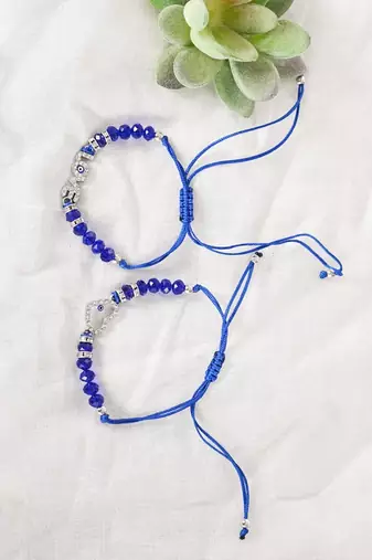  unisex set of 2 blue evil eye rakhi with roli chawal