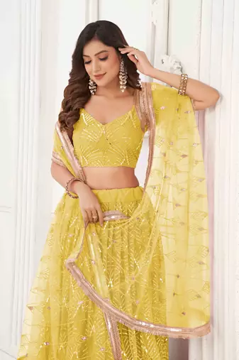 YELLOW NET FABRIC LEHENGA CHOLI WITH SEQUINS AND THREAD EMBROIDERY WORK