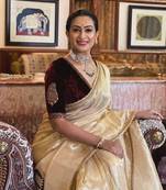 Cream crush tissue silk saree with velvet embroidery stitched blouse