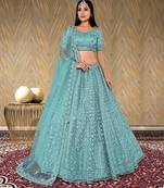 net fabric lehenga choli with zari and diamond work in green color