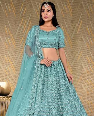 net fabric lehenga choli with zari and diamond work in green color 2