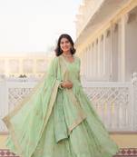 Pista colour heavy zari and sequins work ethnic wedding wear gown with dupatta