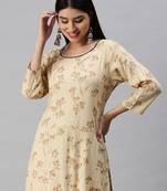 women's round neck floral foil print cream straight kurta and trouser