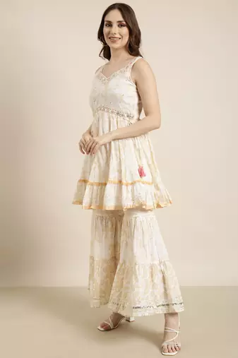 women's sweetheart neck floral foil print cream a-line kurti and sharara with dupatta