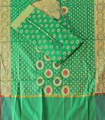 Green color weaving work banarasi jacquard unstitched chudidar dress material 