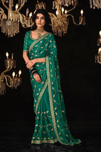 Dark green colour tissue silk sarees for women