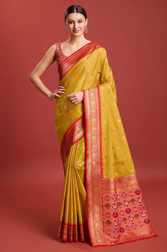 Exquisite Designs With This Regal Mustard Color Patola Pallu Faux Banarasi Tissue Silk Blend Saree