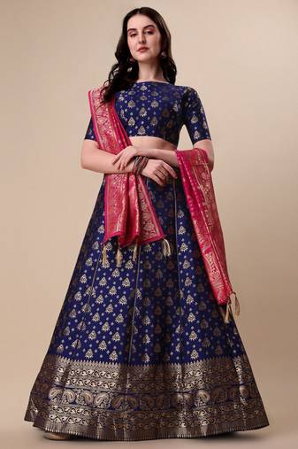 Gorgeous Embroidered Top And Brocade Lehenga With Matching Net Dupatta And Brocade Potli Bag